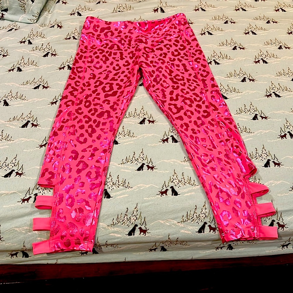 pink neon pants with cuts below. Cheetah print and never used.